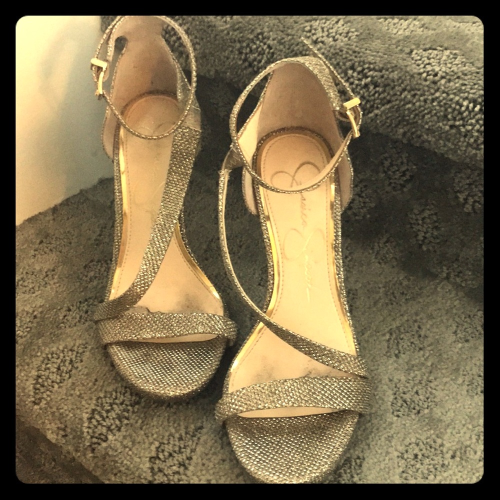 Gold open toed pumps.